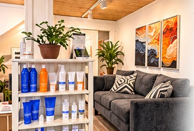 Lori’s inviting private salon with product displays and a comfortable seating area